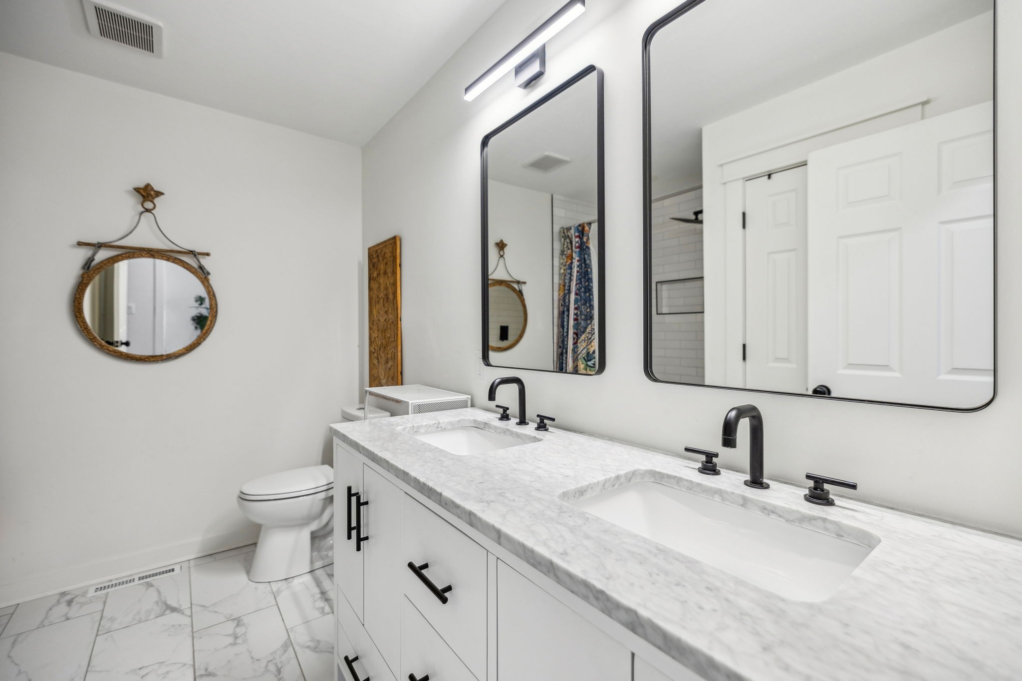 1103 Virginia Avenue Murfreesboro, TN 37130 - Photo 46 of 66 a bathroom with a granite countertop toilet sink and a mirror