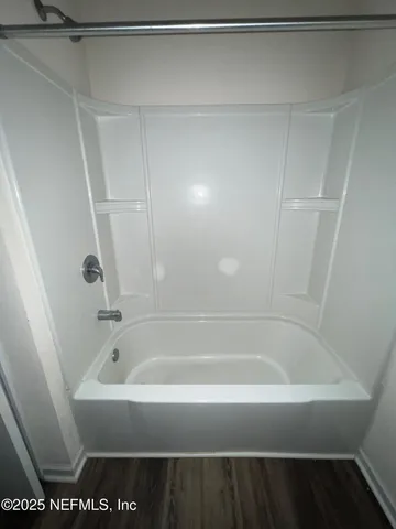 a bathroom with a bathtub