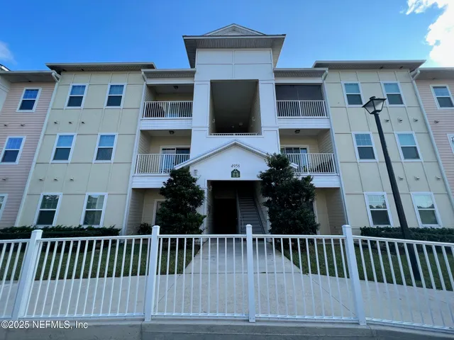 a view of a brick house with a window