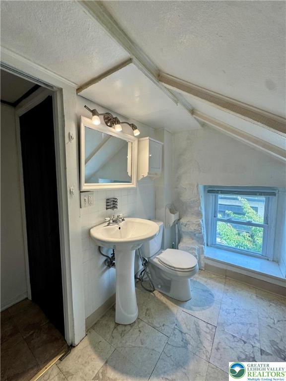 3144 Hamilton Boulevard, Unit 3 Allentown, PA 18103 - Photo 8 of 13 a bathroom with a sink a toilet and mirror