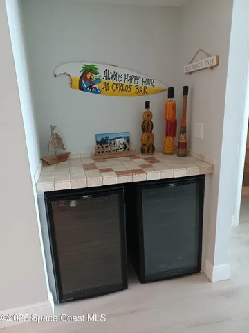 a room with stainless steel appliances kitchen island a stove a sink and a refrigerator