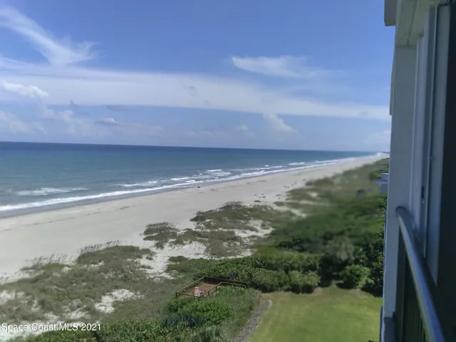 a view of parking garage with cars