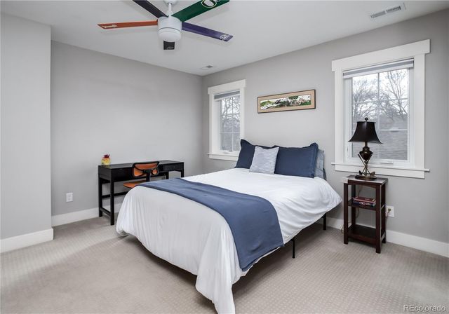 a bedroom with bed and window