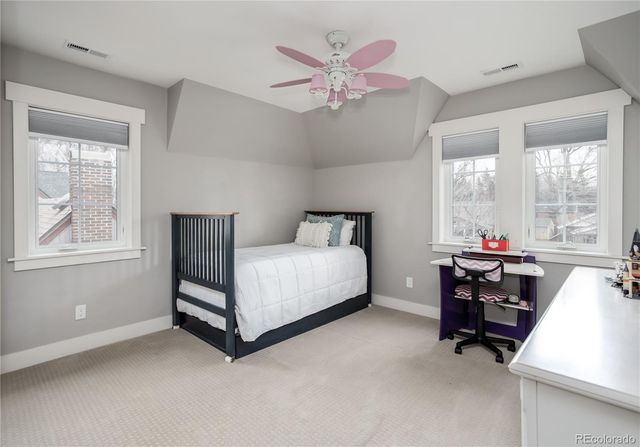 a bed room with a bed and a window