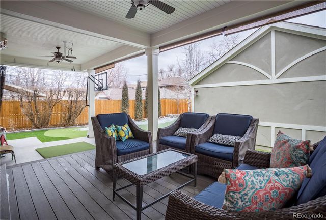 a outdoor living space with furniture and a wooden floor
