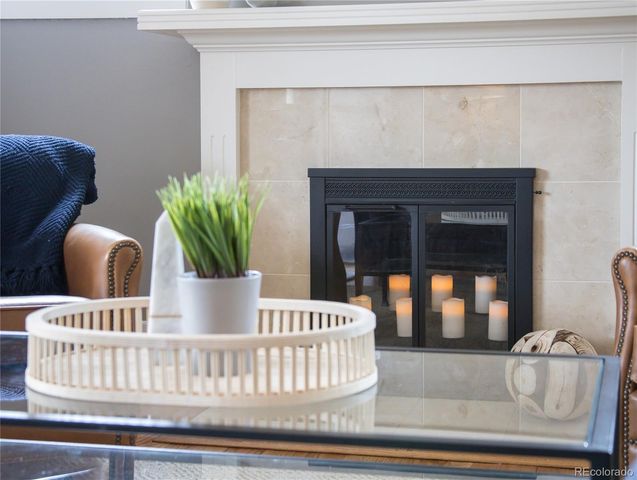 a living room with furniture and potted plant