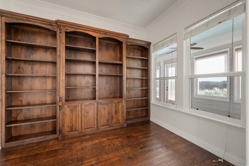 6056 Bennett Lawson Road Mansfield, TX 76063 - Photo 12 of 38 a view of an empty room with wooden floor and a window