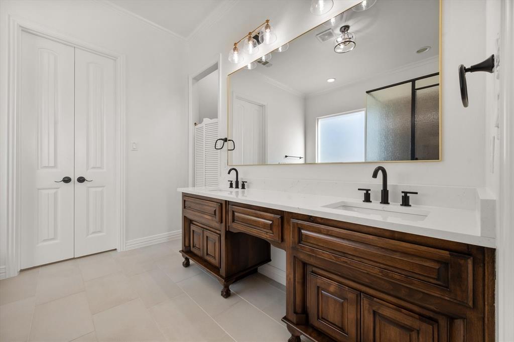6056 Bennett Lawson Road Mansfield, TX 76063 - Photo 13 of 38 a spacious bathroom with a sink double vanity and a mirror