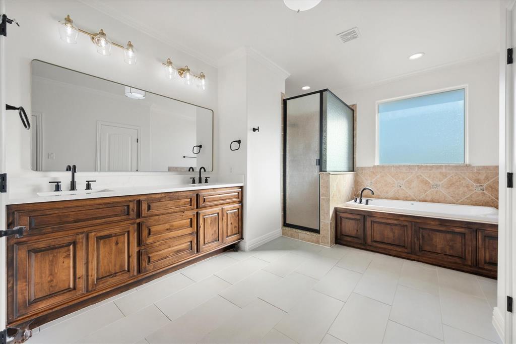 6056 Bennett Lawson Road Mansfield, TX 76063 - Photo 14 of 38 a spacious bathroom with a tub sink and mirror