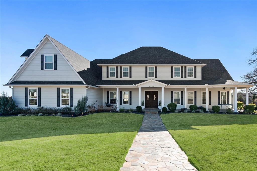 6056 Bennett Lawson Road Mansfield, TX 76063 - Photo 2 of 38 a front view of a house with garden