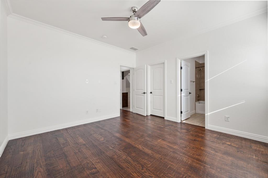 6056 Bennett Lawson Road Mansfield, TX 76063 - Photo 26 of 38 an empty room with wooden floor ceiling fan and window