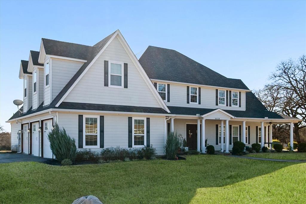 6056 Bennett Lawson Road Mansfield, TX 76063 - Photo 3 of 38 a front view of a house with a yard and porch