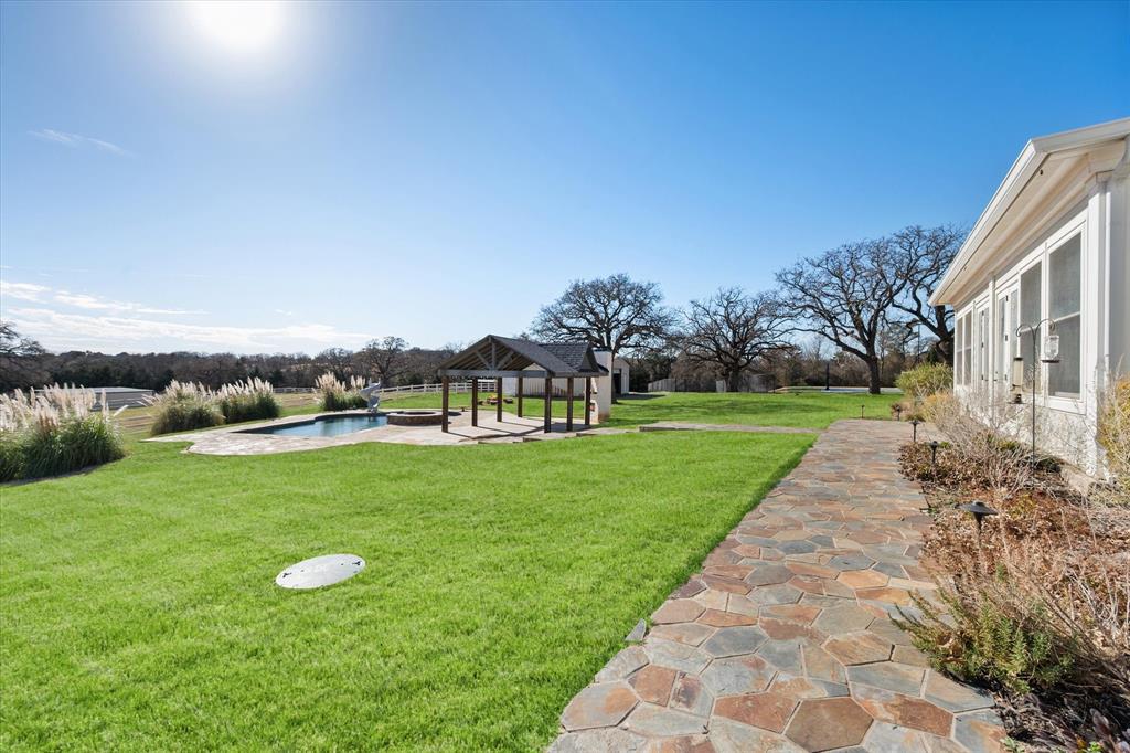 6056 Bennett Lawson Road Mansfield, TX 76063 - Photo 32 of 38 a view of a garden with a building in the background