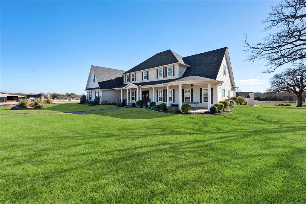 6056 Bennett Lawson Road Mansfield, TX 76063 - Photo 5 of 38 a front view of a house with garden