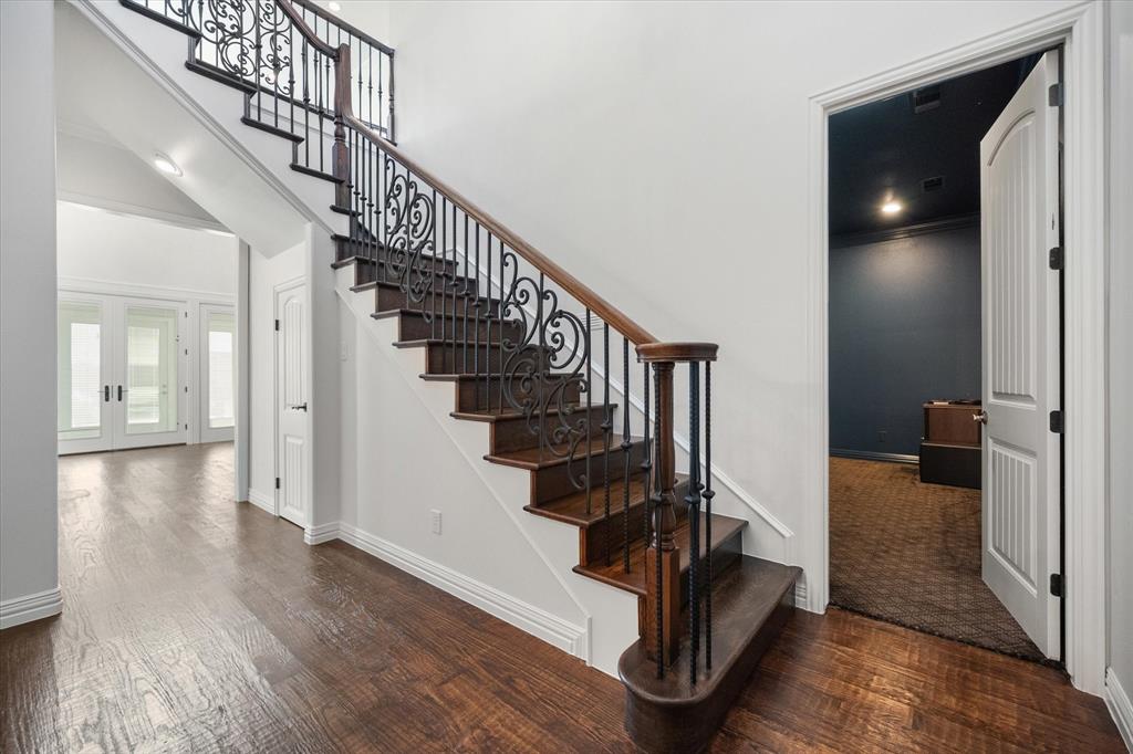 6056 Bennett Lawson Road Mansfield, TX 76063 - Photo 7 of 38 a view of a hallway with wooden floor and stairs