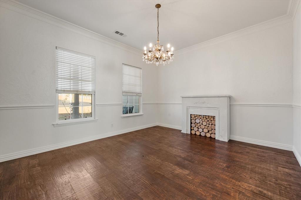 6056 Bennett Lawson Road Mansfield, TX 76063 - Photo 8 of 38 a view of an empty room with wooden floor and a window