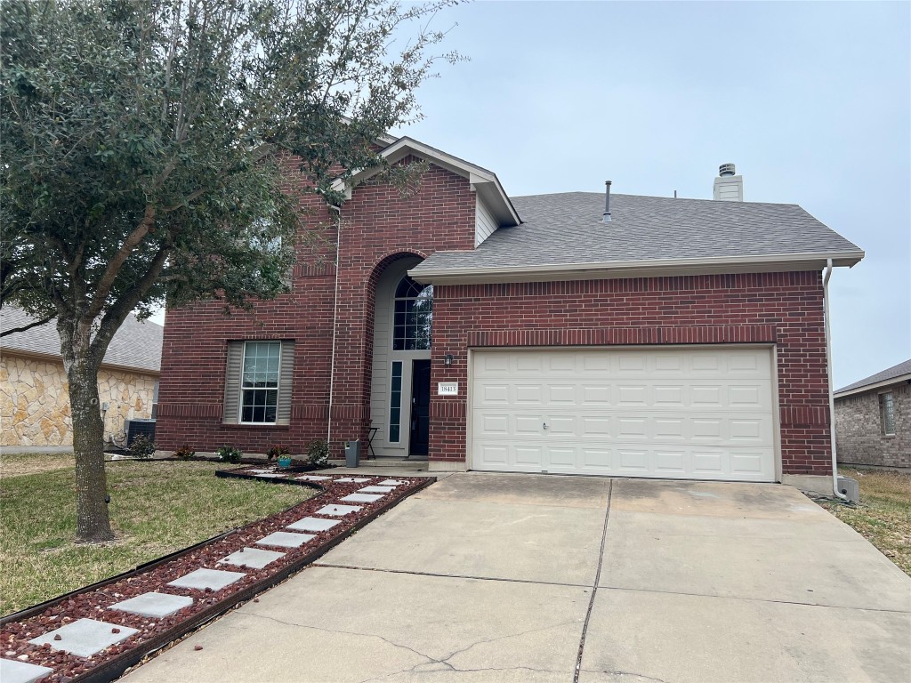 a front view of house with garage