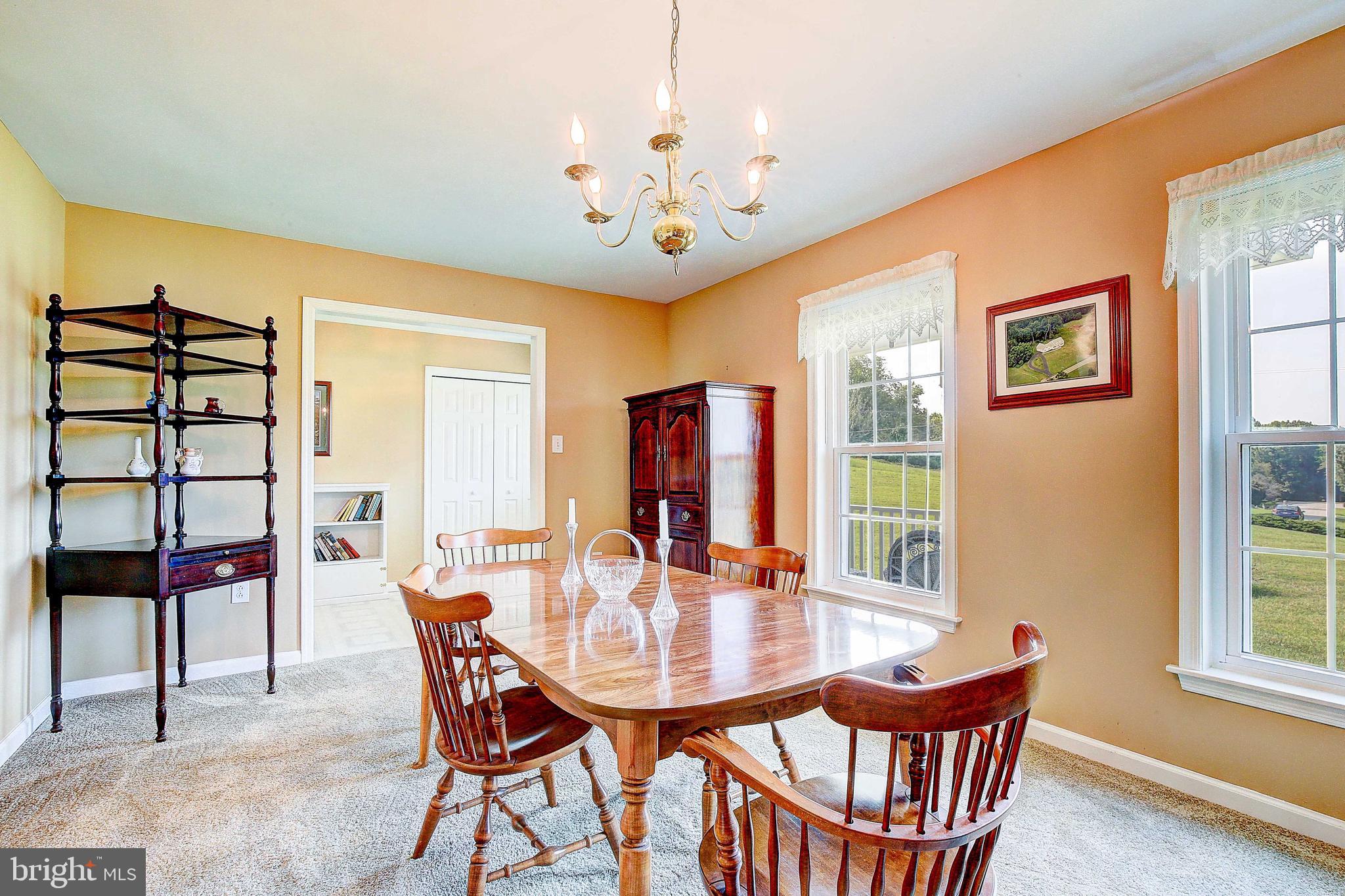 4650 Paul Hance Road Huntingtown, MD 20639 - Photo 14 of 57 a dining room with furniture and window