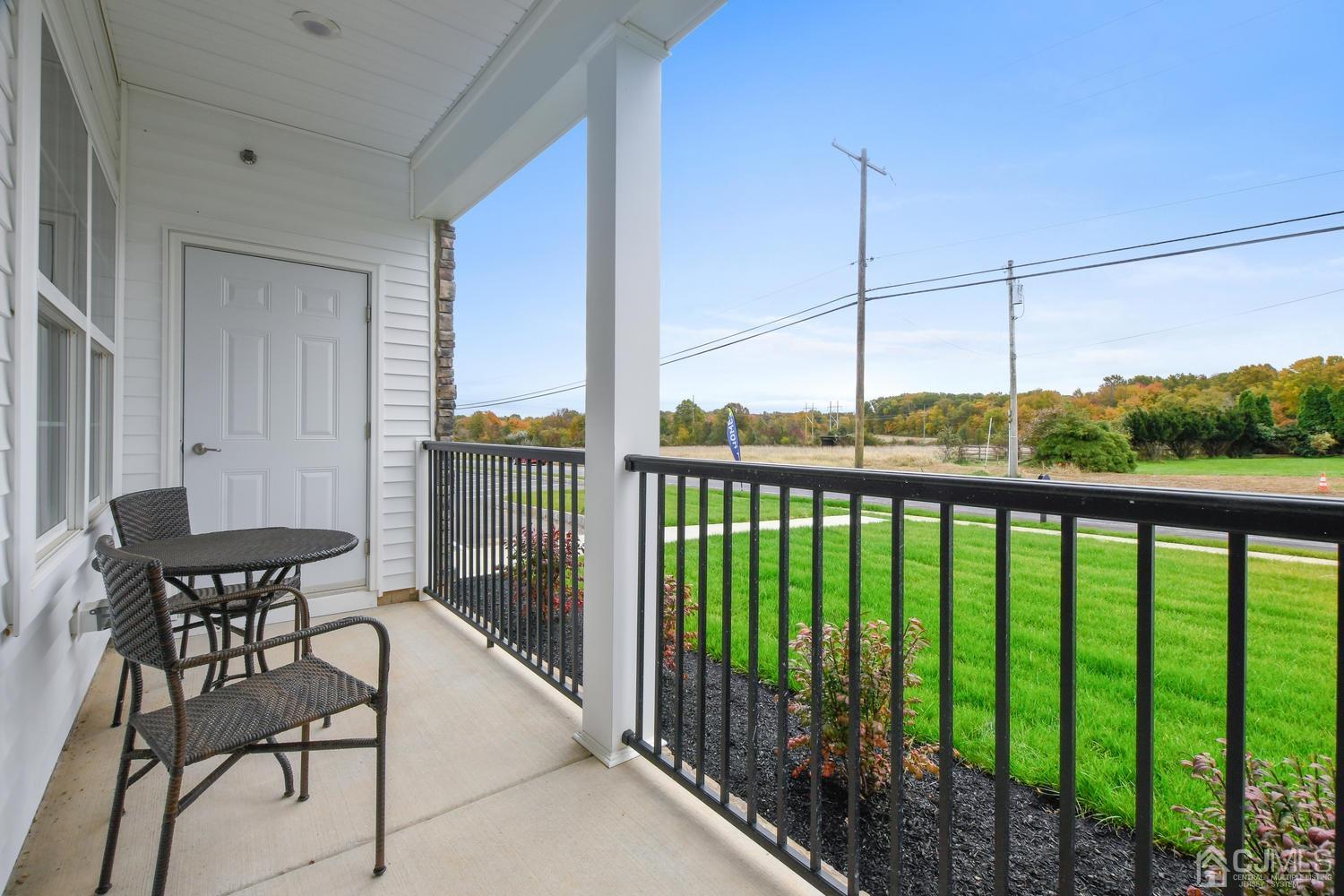 524 Tavern Road Monroe Township, NJ 08831 - Photo 4 of 4 a view of a balcony with chairs