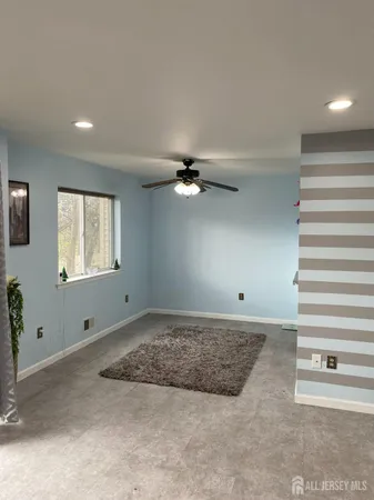 a view of an empty room and a window