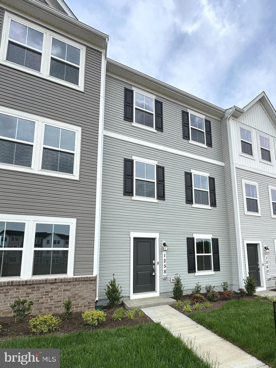 1258 Cedar Vly Road Ranson, WV 25438 - Photo 1 of 46 a front view of a house with yard and green space