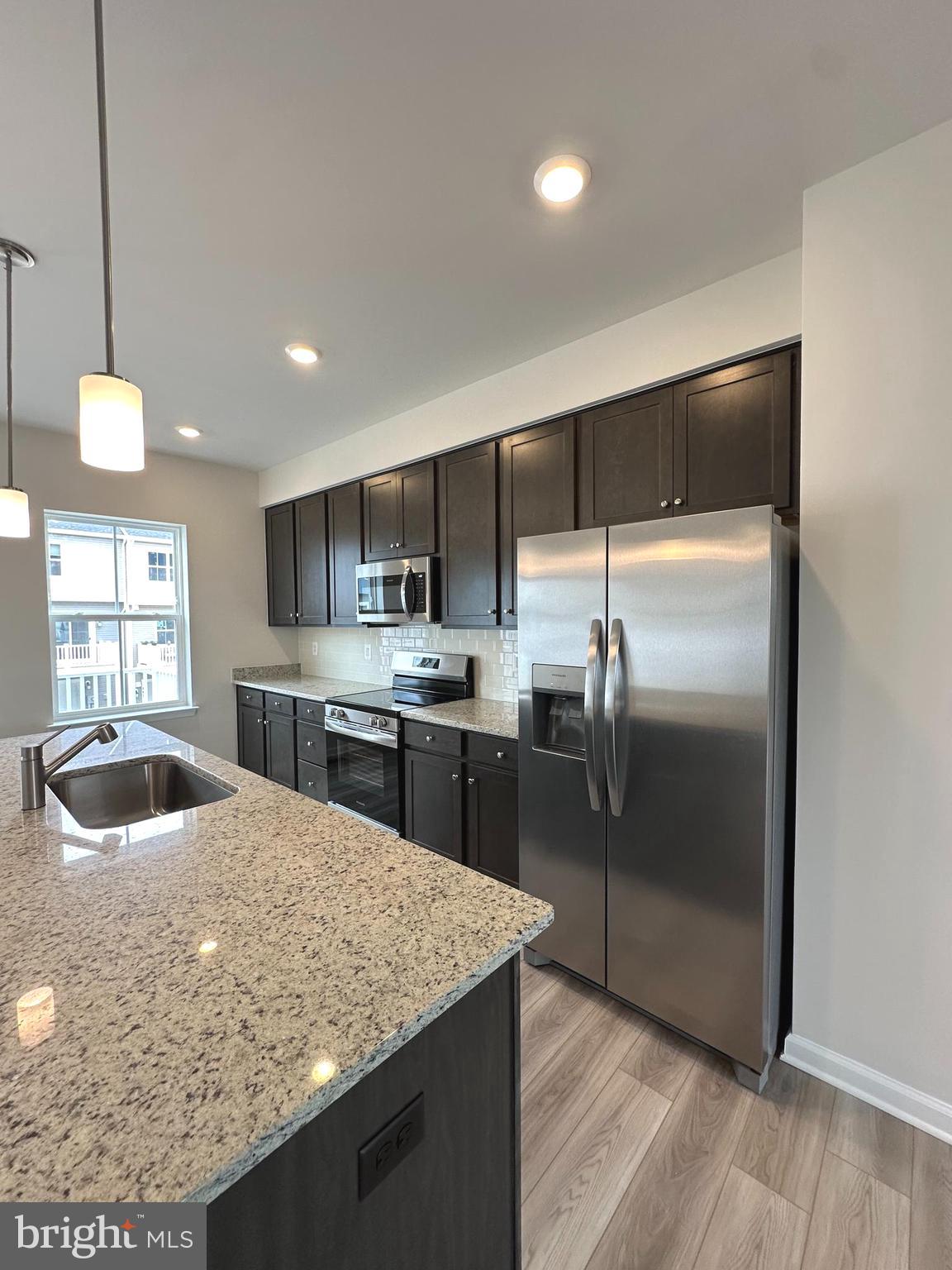 1258 Cedar Vly Road Ranson, WV 25438 - Photo 17 of 46 a kitchen with kitchen island a counter top space a sink stainless steel appliances and cabinets