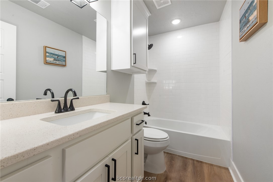 244 Brazos Bend Snook, TX 77879 - Photo 24 of 33 a bathroom with a sink a toilet and a bathtub