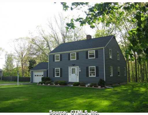 Exterior Front. Picturesque center hall colonial situated on over an acre level lightly wooded lot.