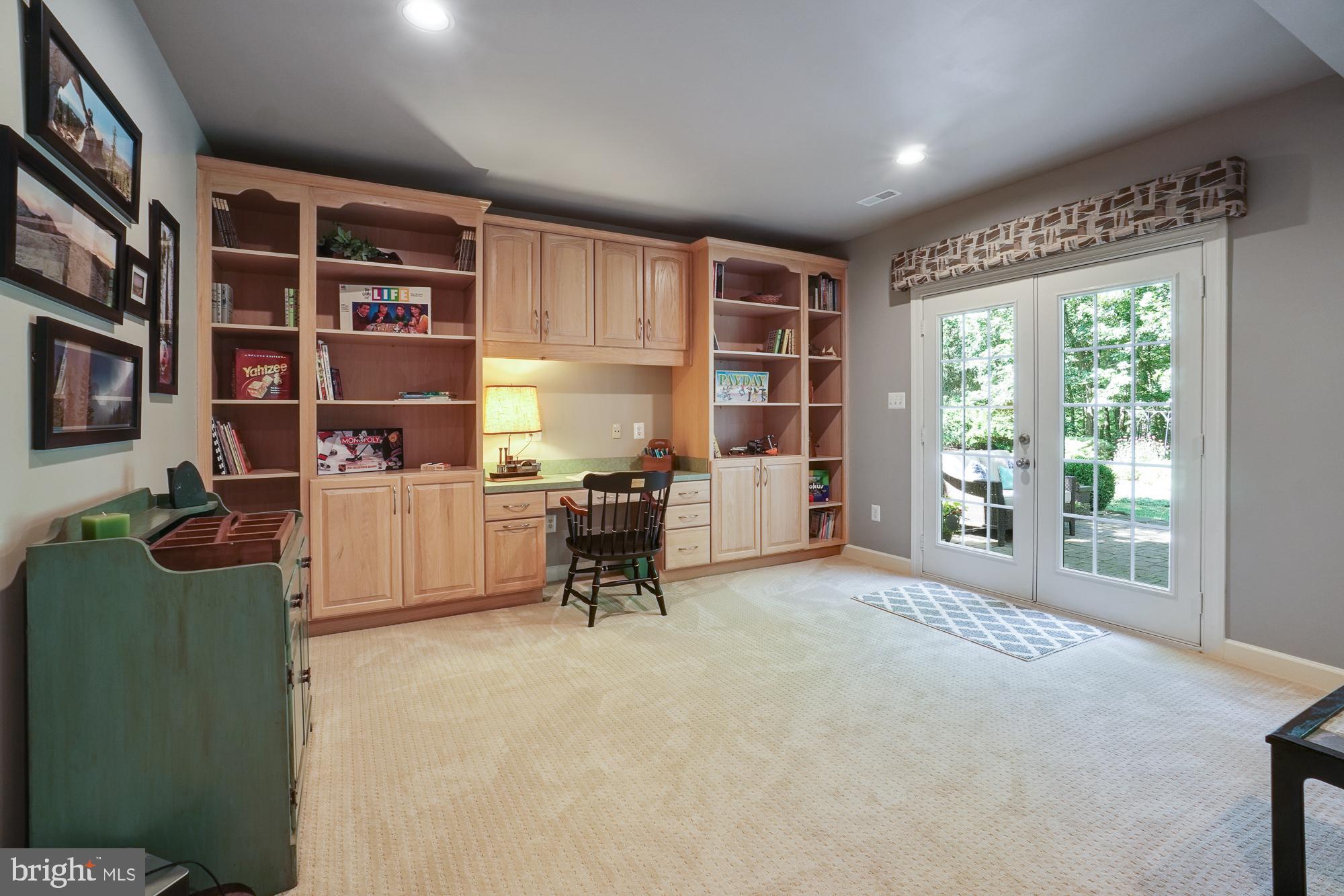 18 Hackett Court Poolesville, MD 20837 - Photo 61 of 82 Built-ins will hold all games. Walk-out to patio