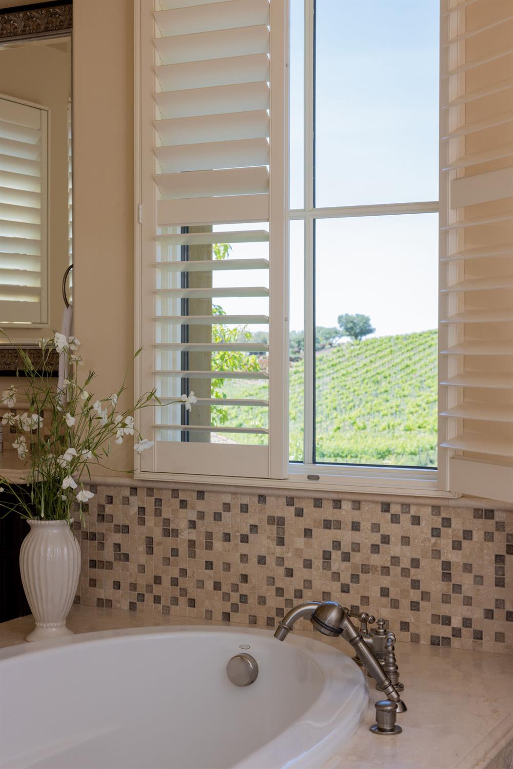 5301 Montserrat Lane Loomis, CA 95650 - Photo 14 of 32 a bathroom with a bathtub and window