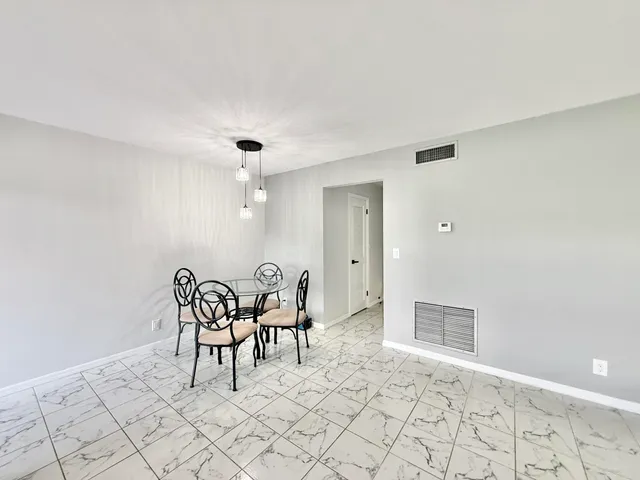 a view of a livingroom with furniture and chandelier
