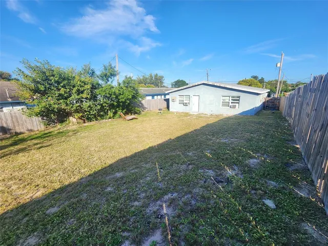 a view of a yard with an empty space
