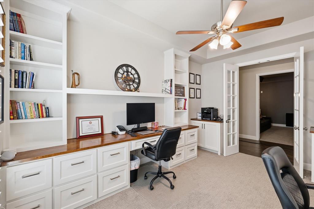 9708 Surveyor Road Oak Point, TX 75068 - Photo 15 of 34 Dedicated office space featuring extensive built-in white cabinetry, wood-finish countertops, and integrated shelving