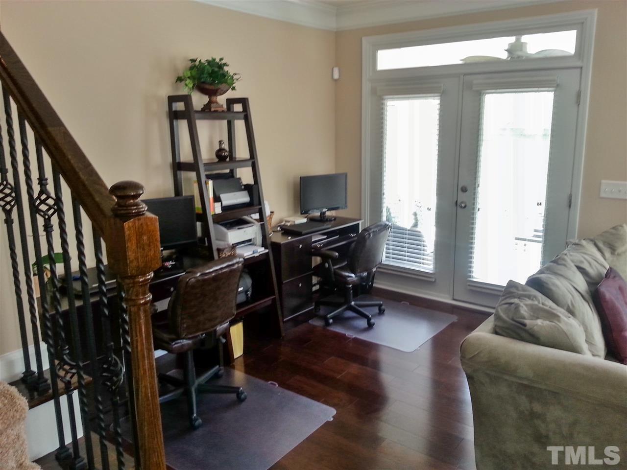 10131 Lynnberry Place Raleigh, NC 27617 - Photo 14 of 25 Large rectangular family room accommodates several different furniture layouts, including plenty of office space for two!