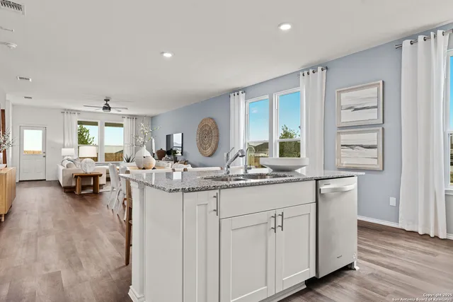 a view of living room with granite countertop furniture and a fireplace