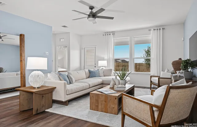 a living room with furniture and a large window