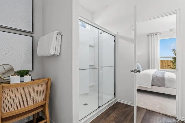 a bathroom with a shower and a sink