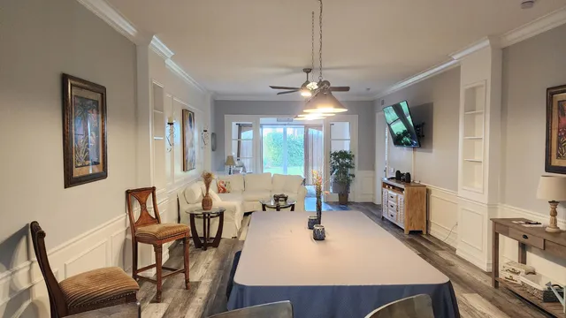 a view of a dining room with furniture window and wooden floor