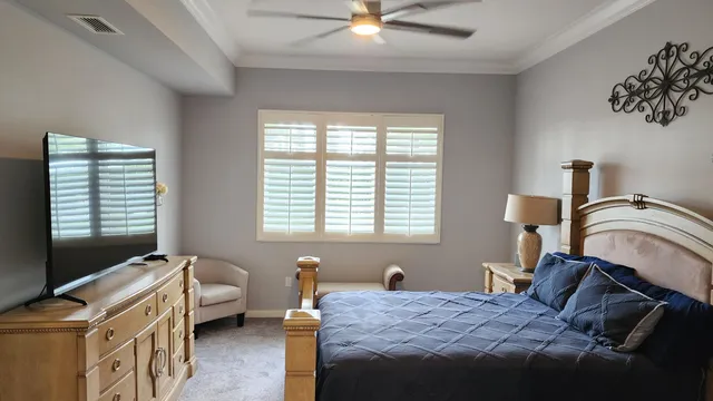 a bedroom that has a bed and a couch