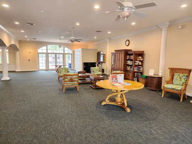 a living room with furniture and white walls
