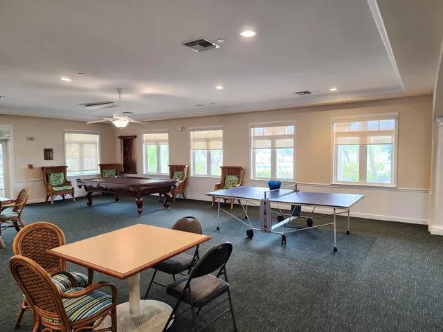 a living room with furniture a rug and a window