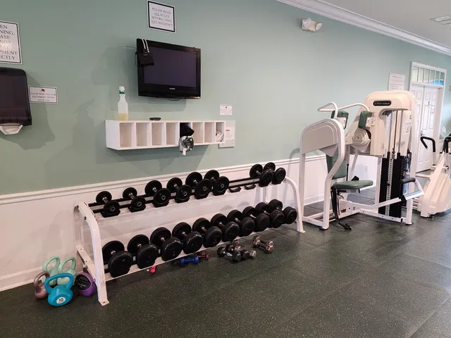 a bedroom with bed and a tv