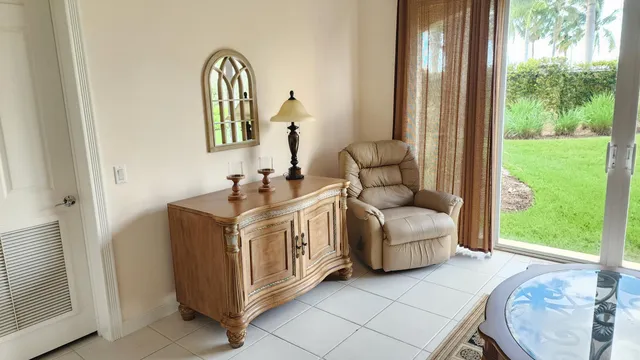 a living room with a bed and a window