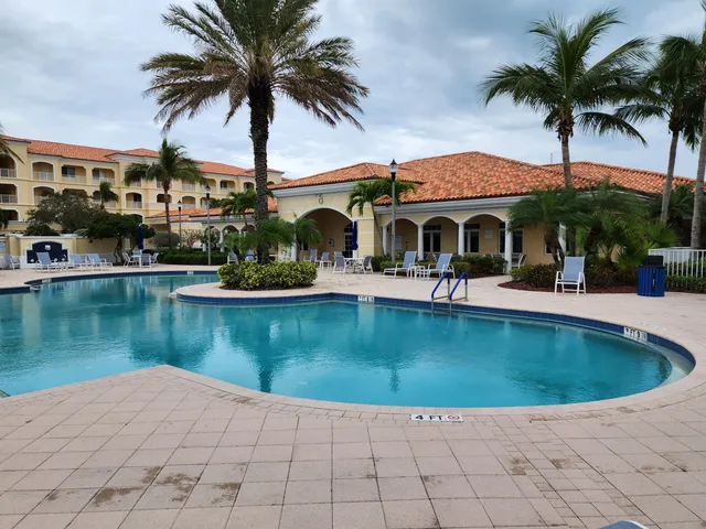 a swimming pool view with a lake view