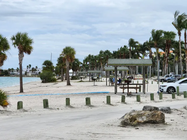 a view of a swimming pool with outdoor seating