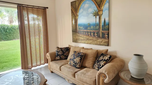 a living room with furniture and a window