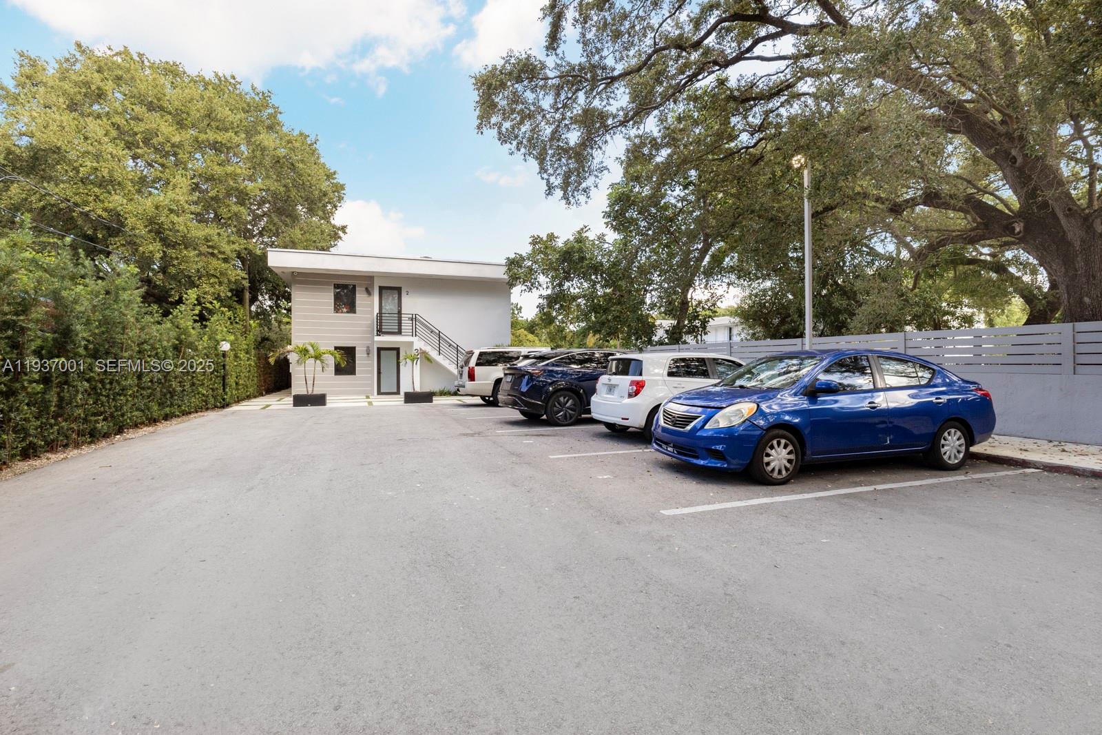 a view of a cars parked in front of a house