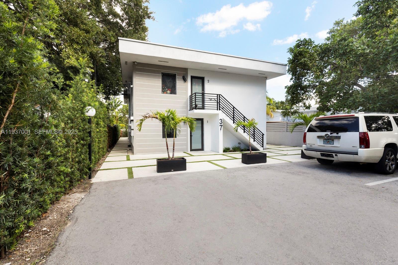 37 Northwest 59th Street, Unit 7 Miami, FL 33127 - Photo 2 of 15 a view of a car park in front of house