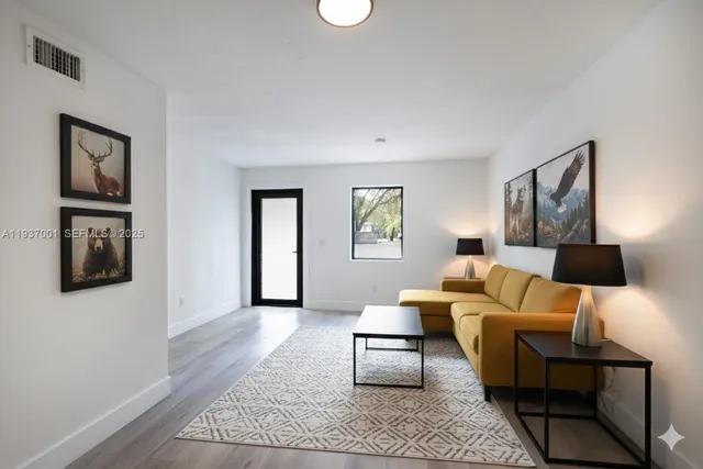 a living room with furniture and a couch