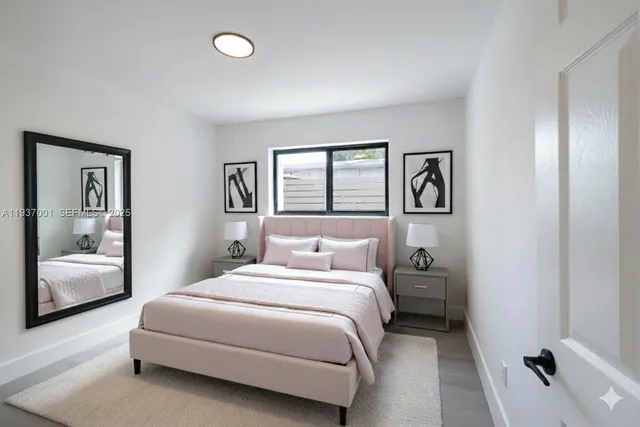 a bedroom with a bed and a couch